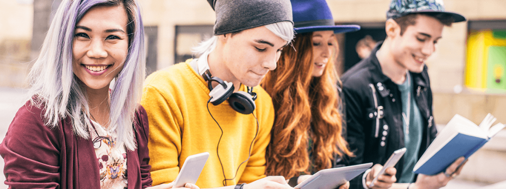 Teens reading books and looking at their phones